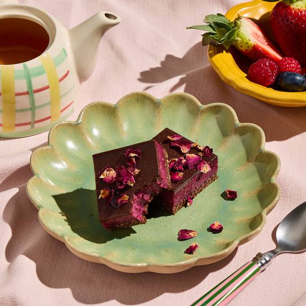Chocolate berry slice topped with rose petals