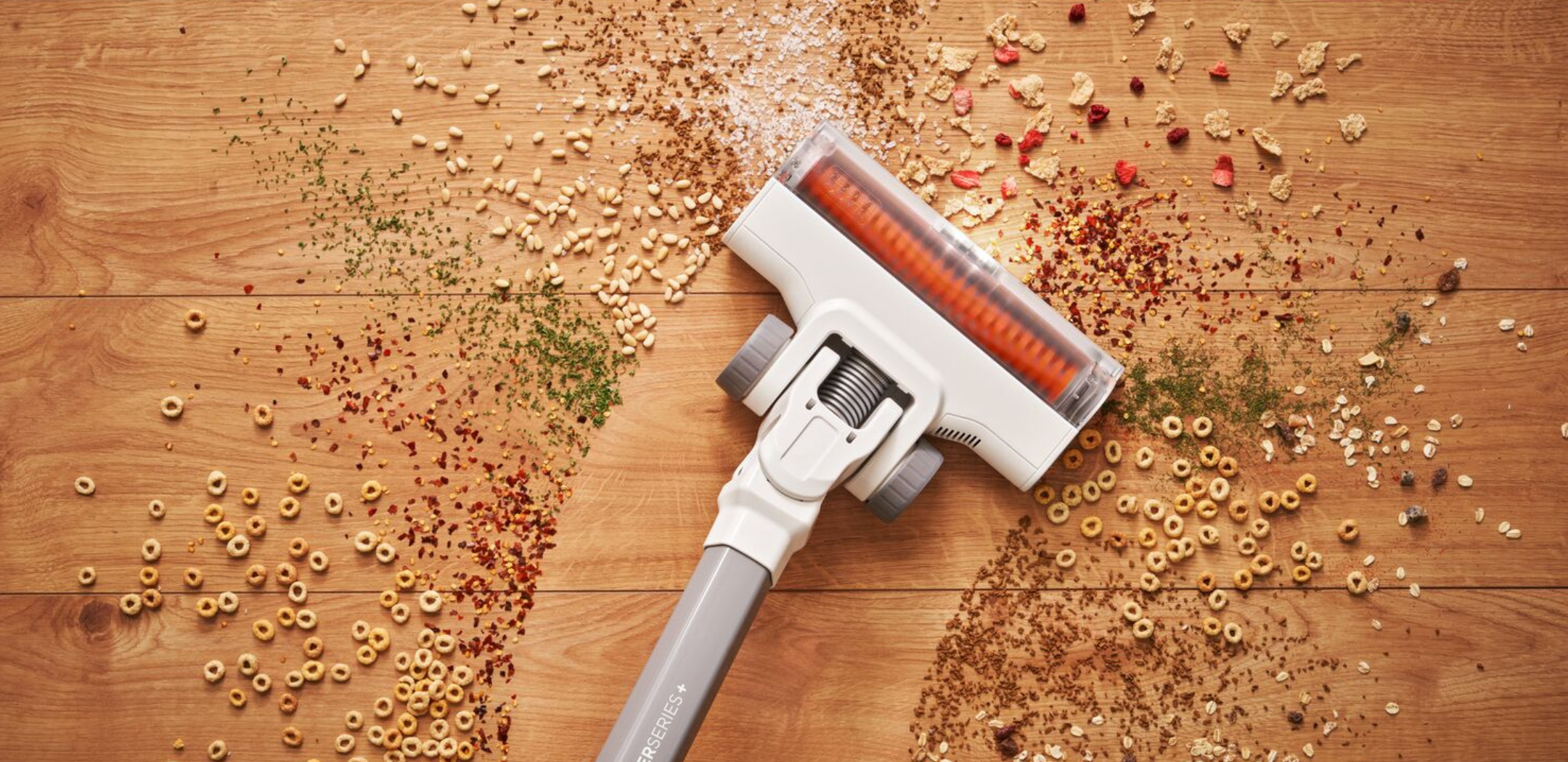 POWERSERIES Cordless Stick Vacuum being used to clean mess on a floor.