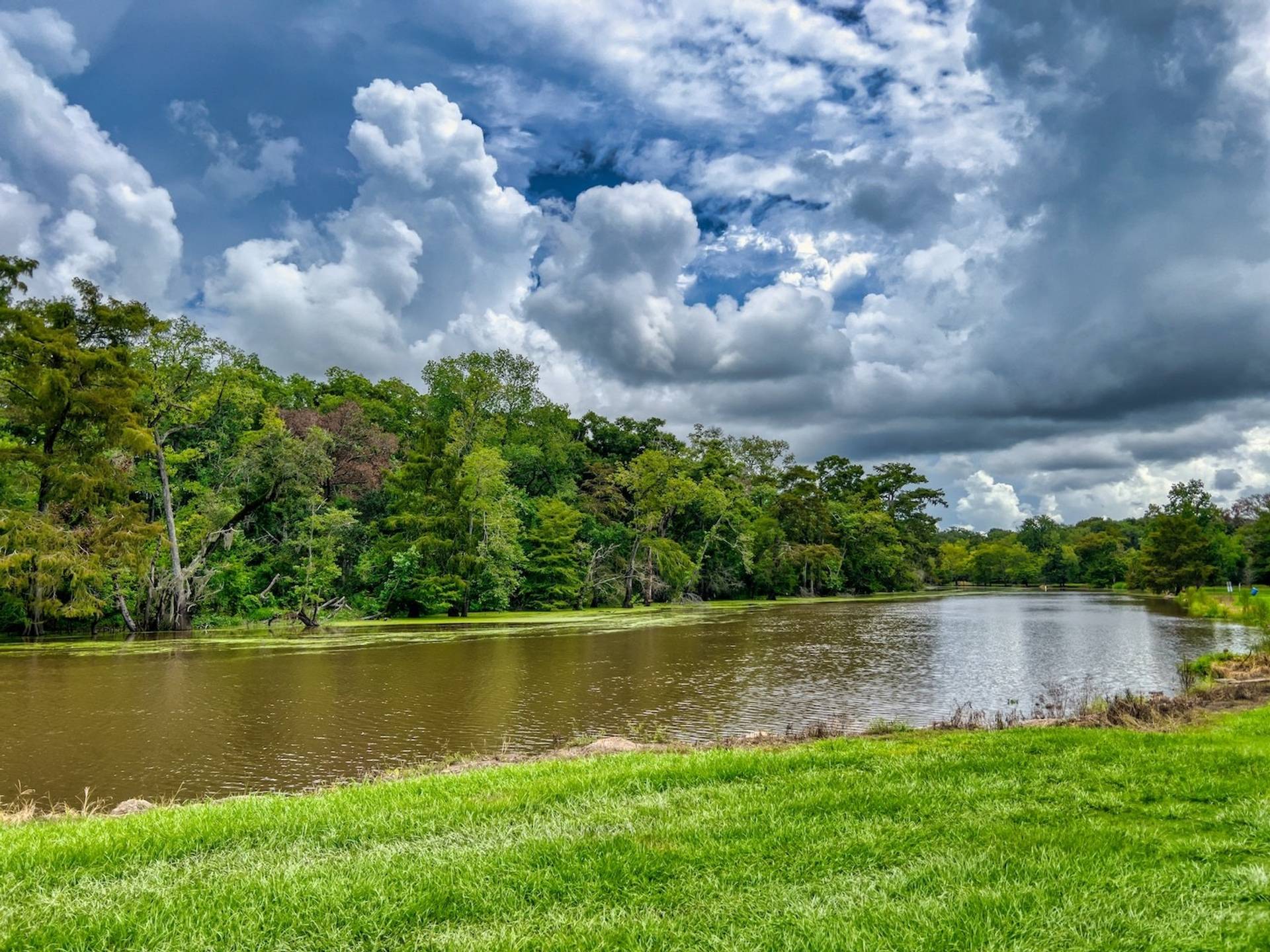 Bayou river with looming stormy sky to represent where to buy e-bikes in Louisiana