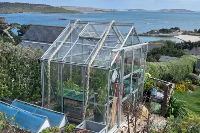 Rhino greenhouse overlooking the sea