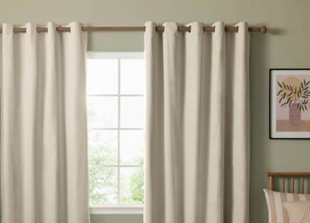 Cream coloured eyelet curtains
