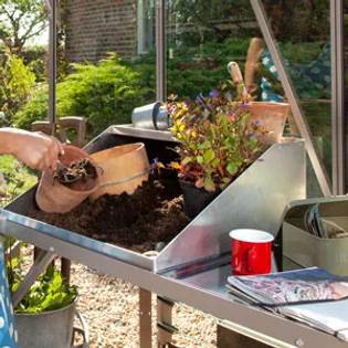 lady potting up plants using potting pal