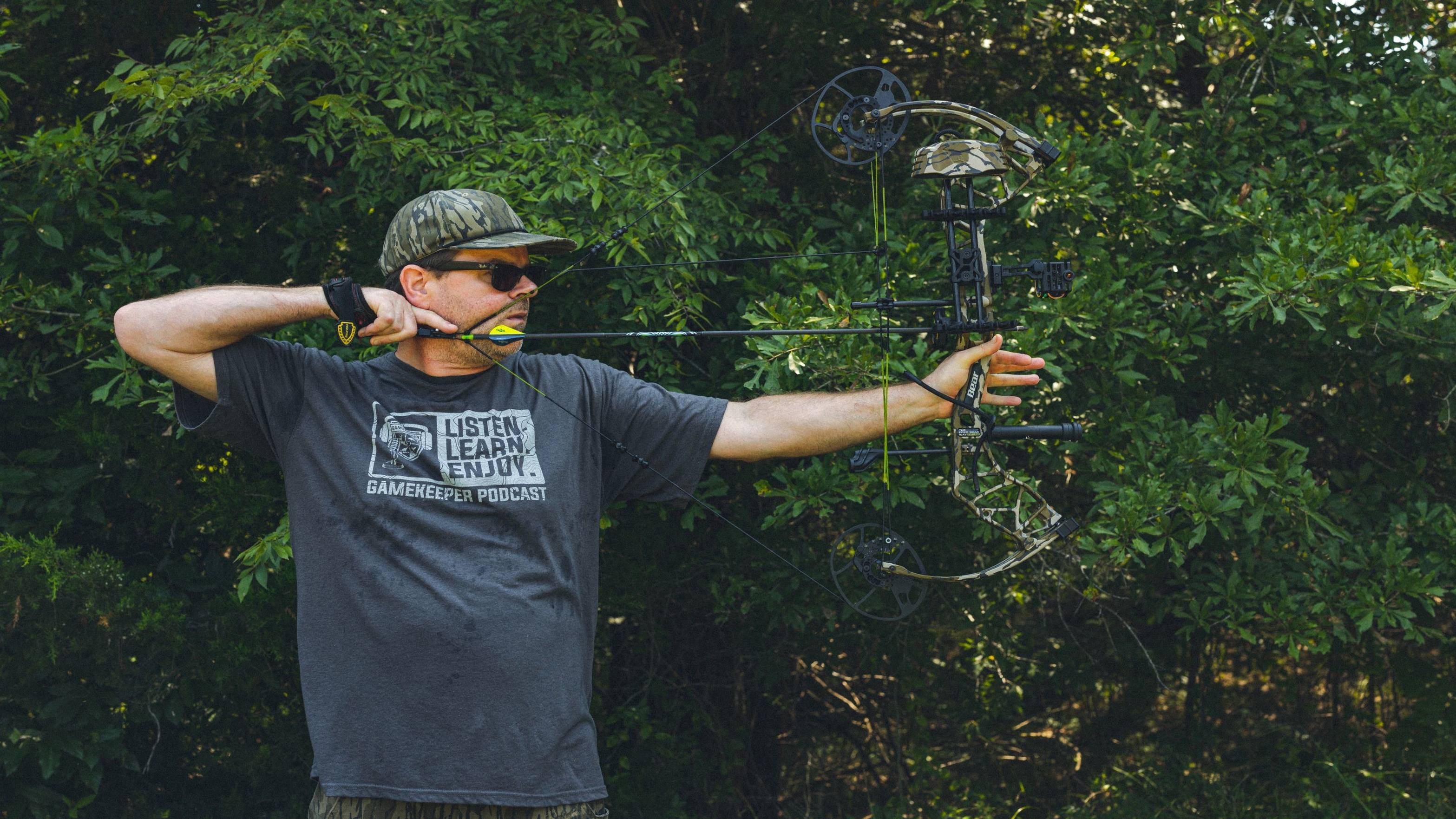 Man shooting the Bear Archery Gamekeeper compound bow.