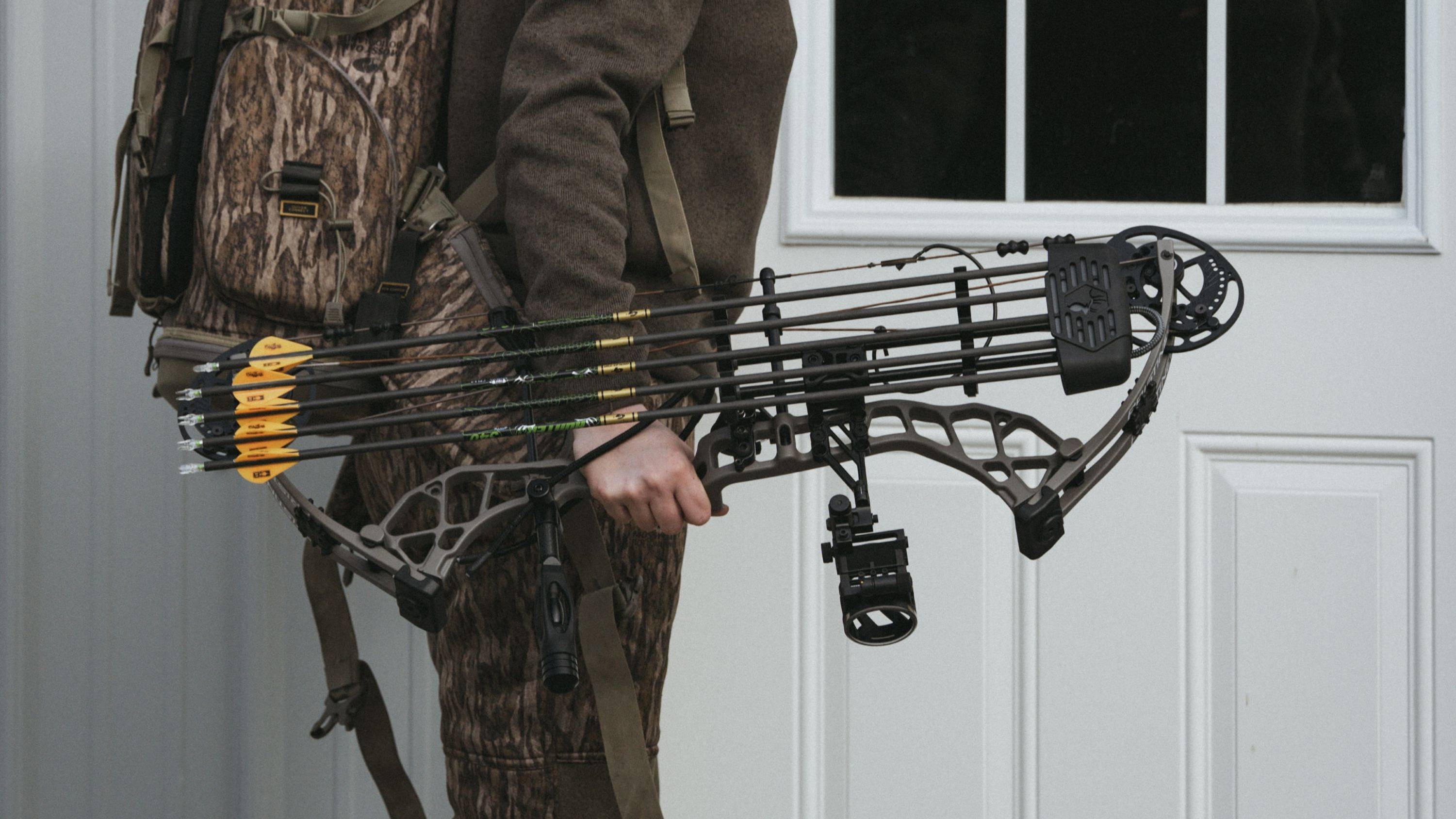 Person holding the Pristine RTH womens compound bow from Bear Archery.