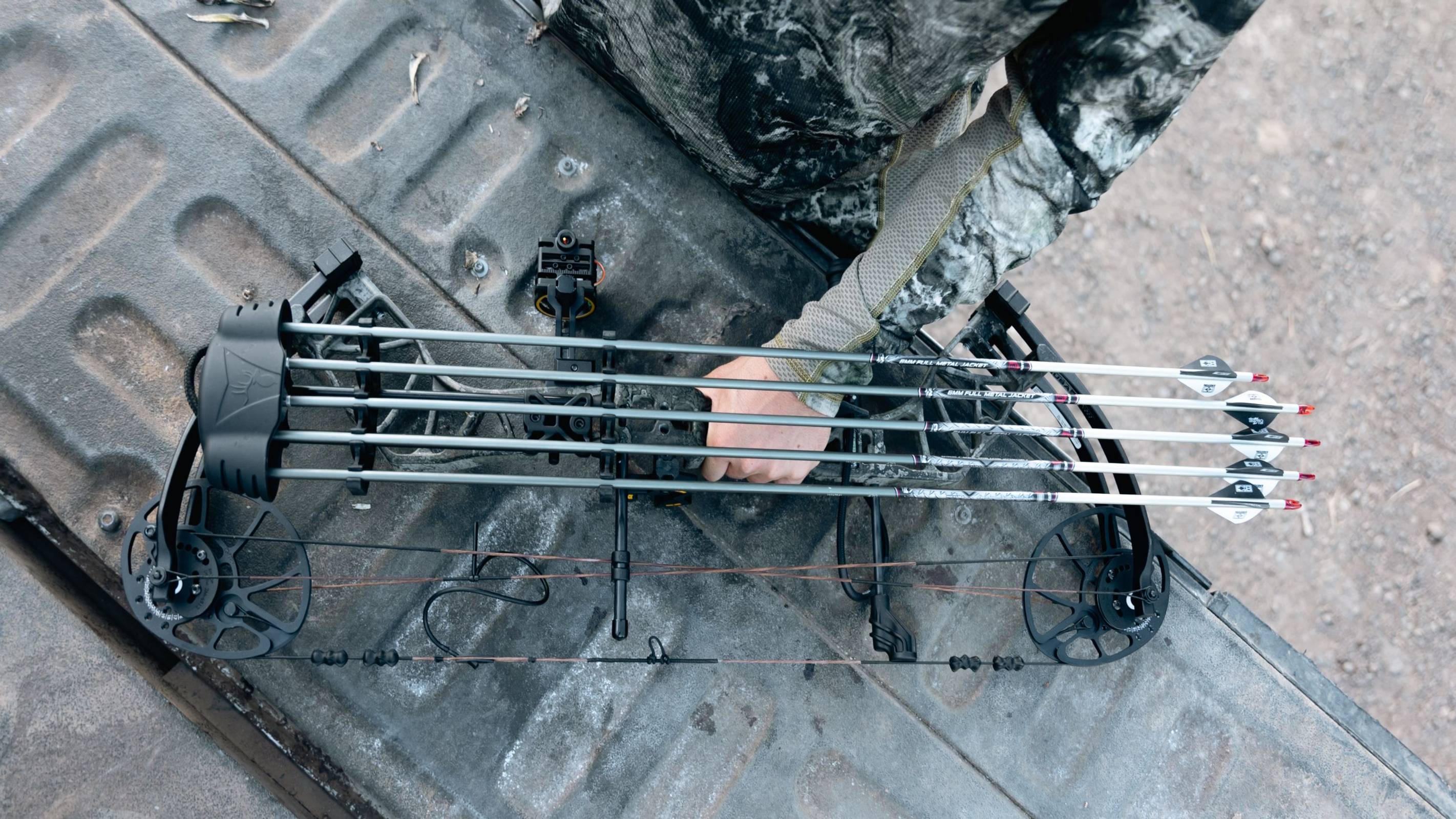 Bear Legit MAXX from Bear Archery laying on the back of a truck bed.