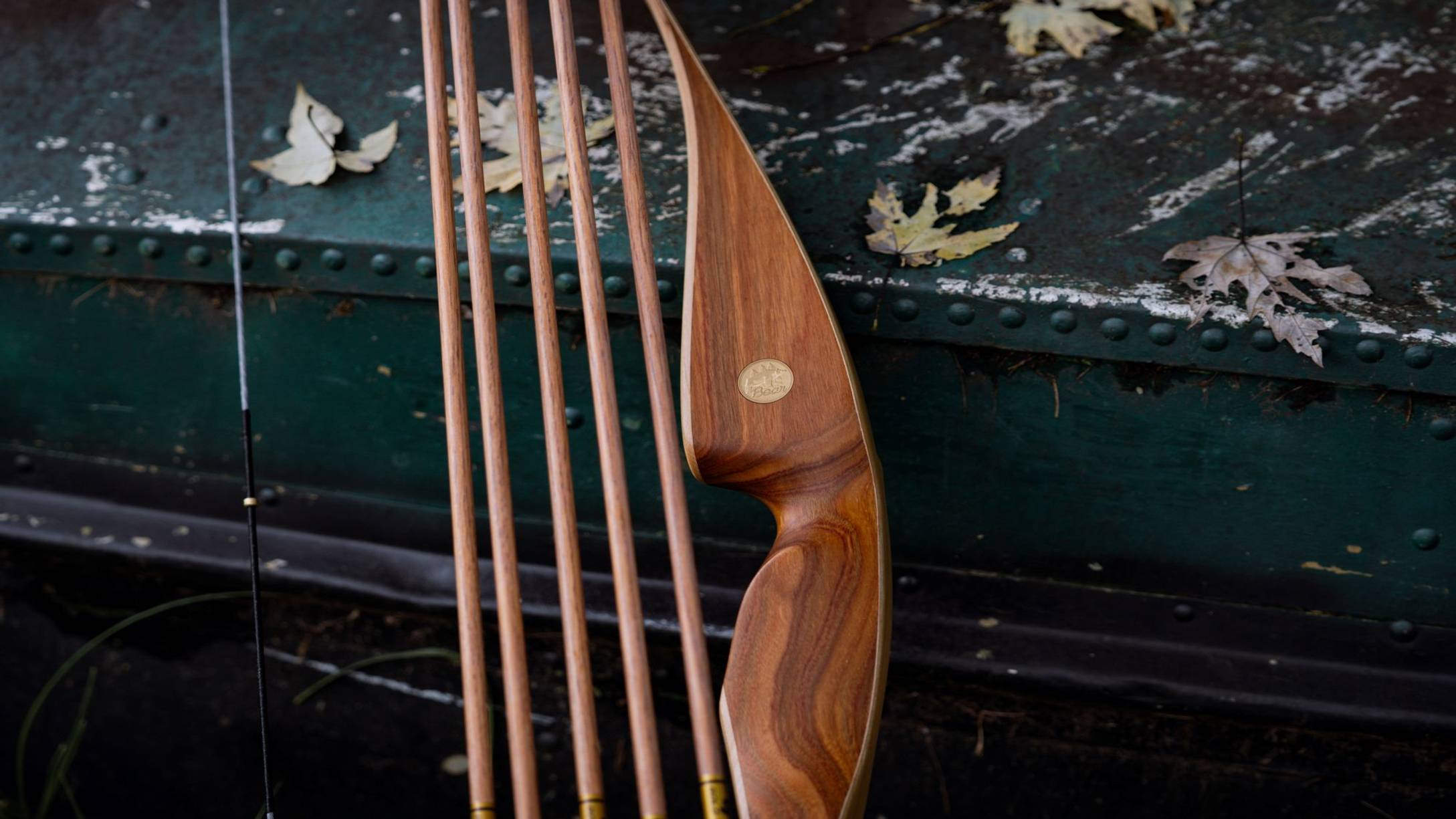 Close up of the traditional Bear Archery medallion on the Grizzly Hunter Hybrid Longbow. 