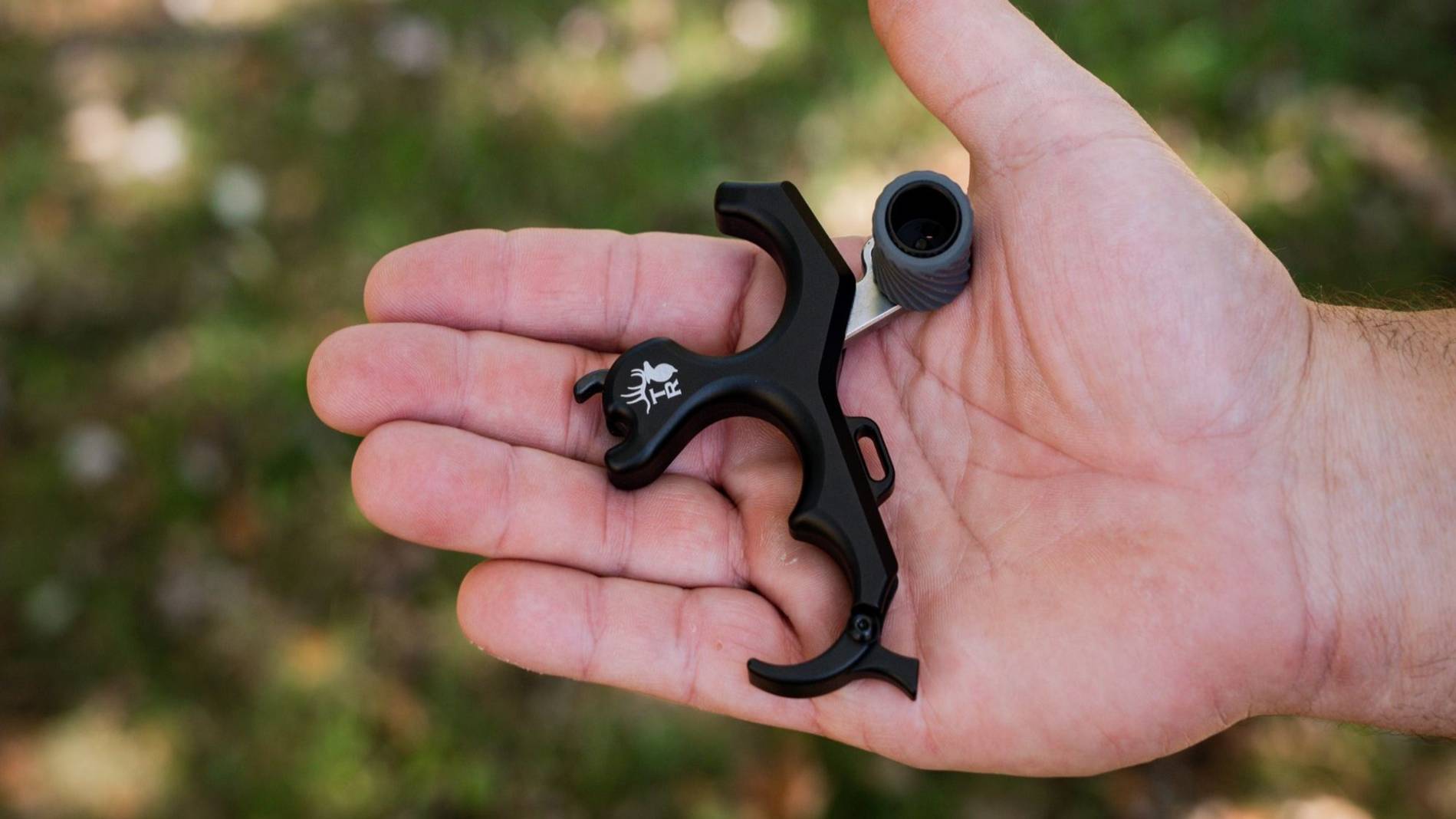 The Precise RKX from Trophy Ridge shown laying in someone's hand.