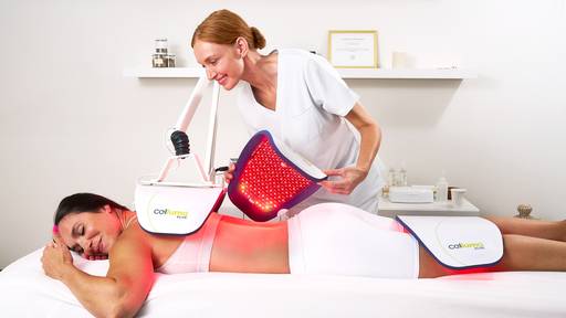 Patient getting a red light therapy treatment with the Celluma ELITE 3 panel system on the contour mode and getting assisted by a licensed professional. 