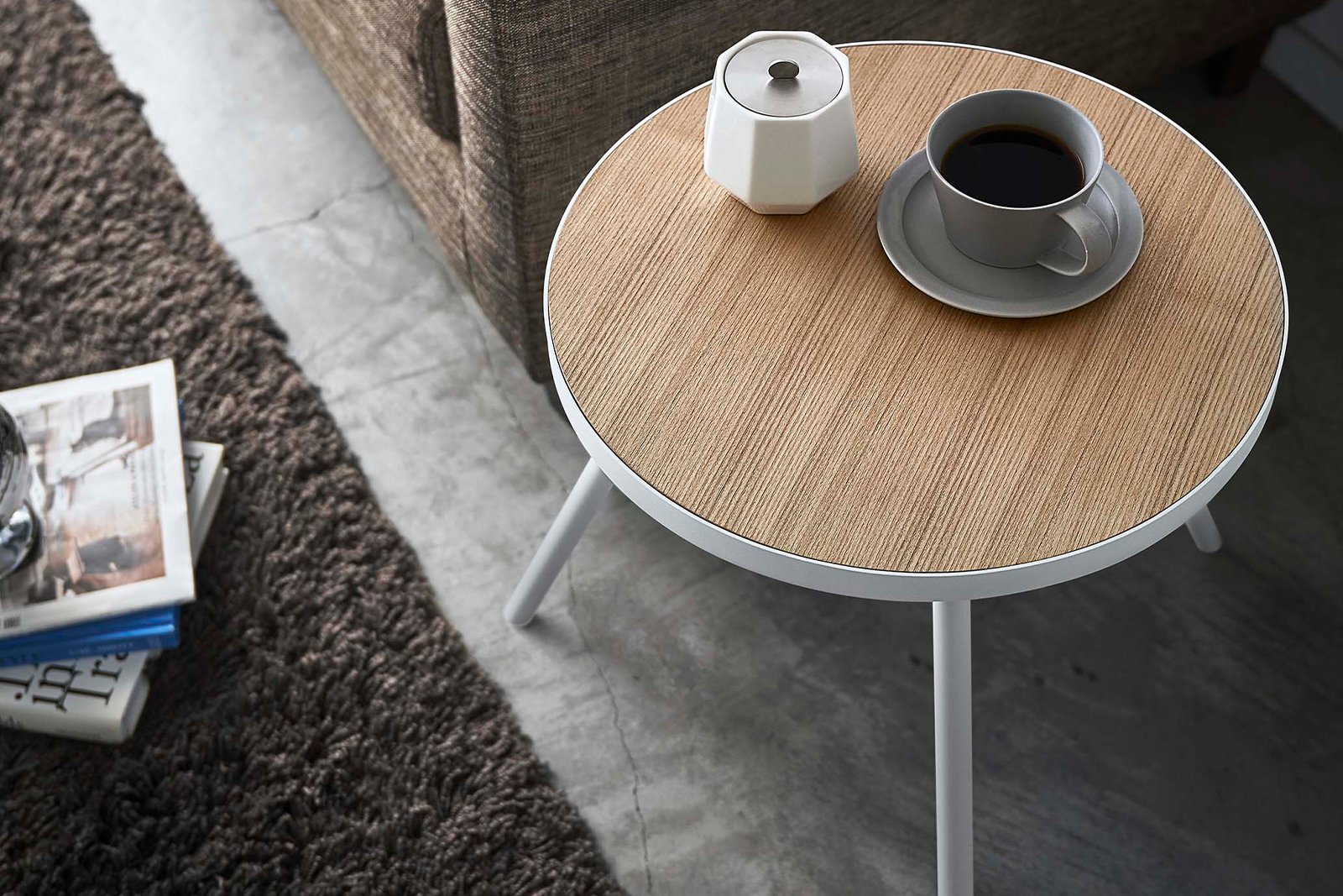 Aerial view of Yamazaki Home round side table with a coffee mug. 