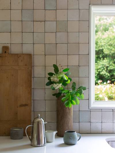 clé tile terracotta rice paper 4x4 tile installed on an kitchen backsplash