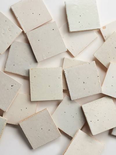 clé tile terracotta rice paper 4x4 tiles scattered across photo
