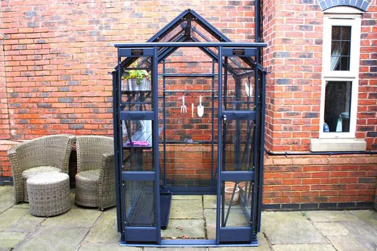 Elite compact 4x4 greenhouse on paving slabs