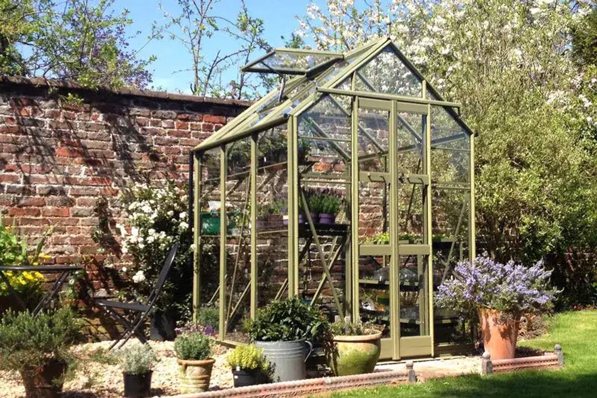 Streamline greenhouse with olive frame