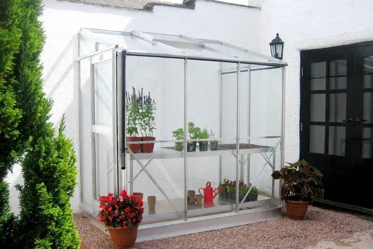 Windsor lean to greenhouse on white wall