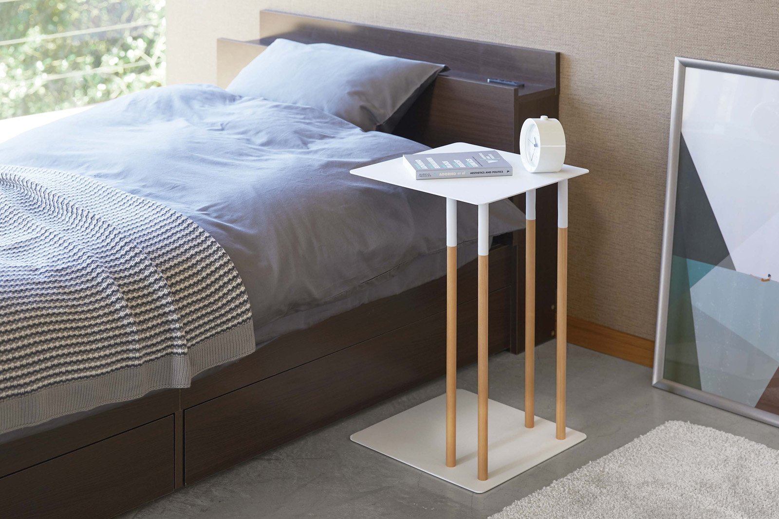 Yamazaki Home white C Side Table next to the bed. 