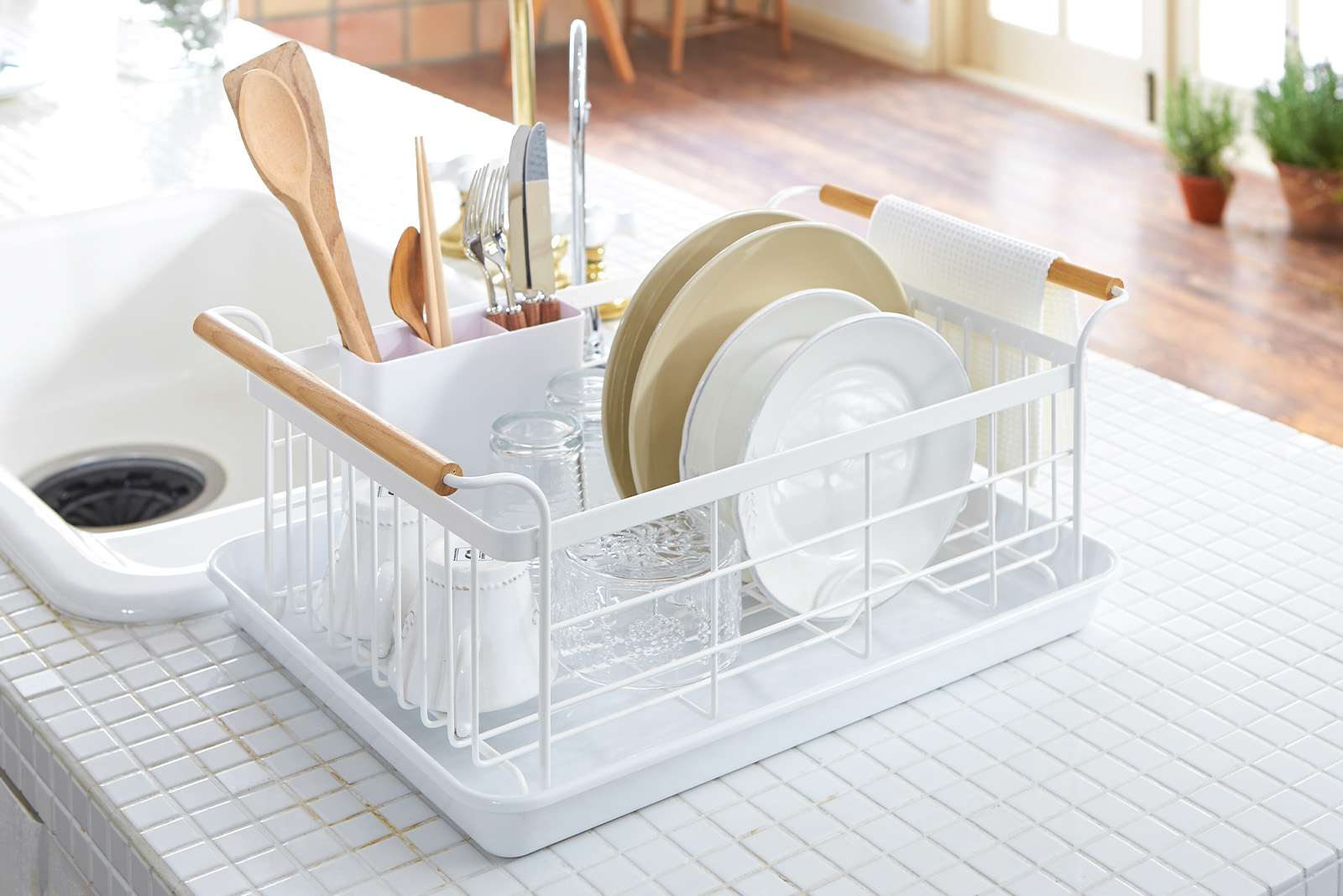 Yamazaki Home Dish Rack holding plates on a kitchen counter. 
