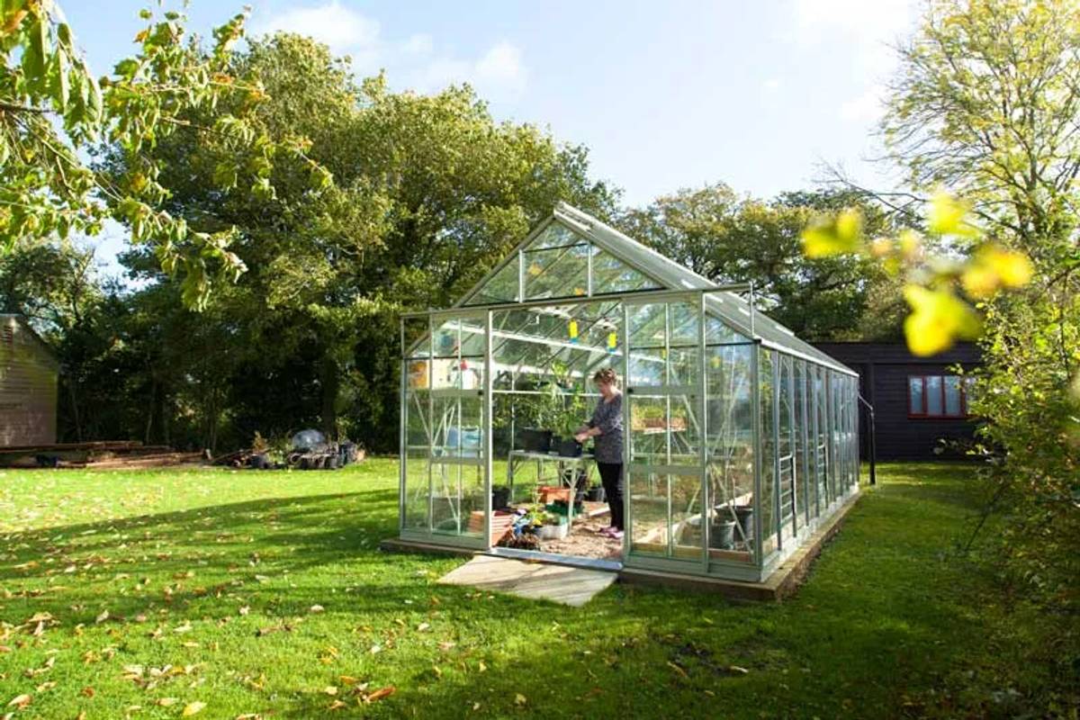 Large greenhouse in middle of garden