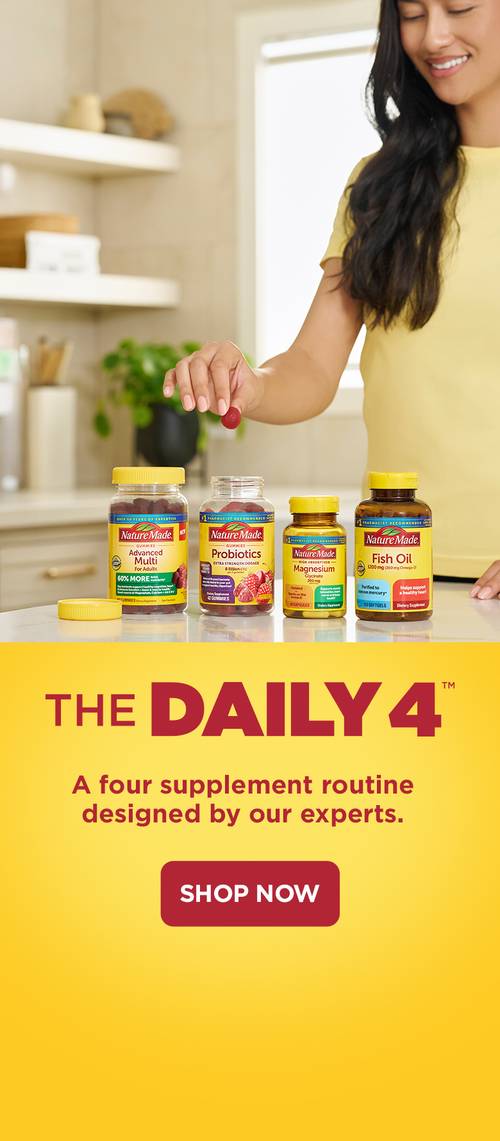 Hand picking a gummy vitamin from a lineup of Nature Made supplements, including multivitamins, probiotics, magnesium, and fish oil, with ‘The Daily 4’ supplement routine promotion displayed below and a red shop now button.