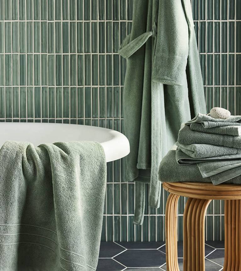 Brooklinen Super-Plush Bath Towels in the color Eucalyptus in a Bathroom