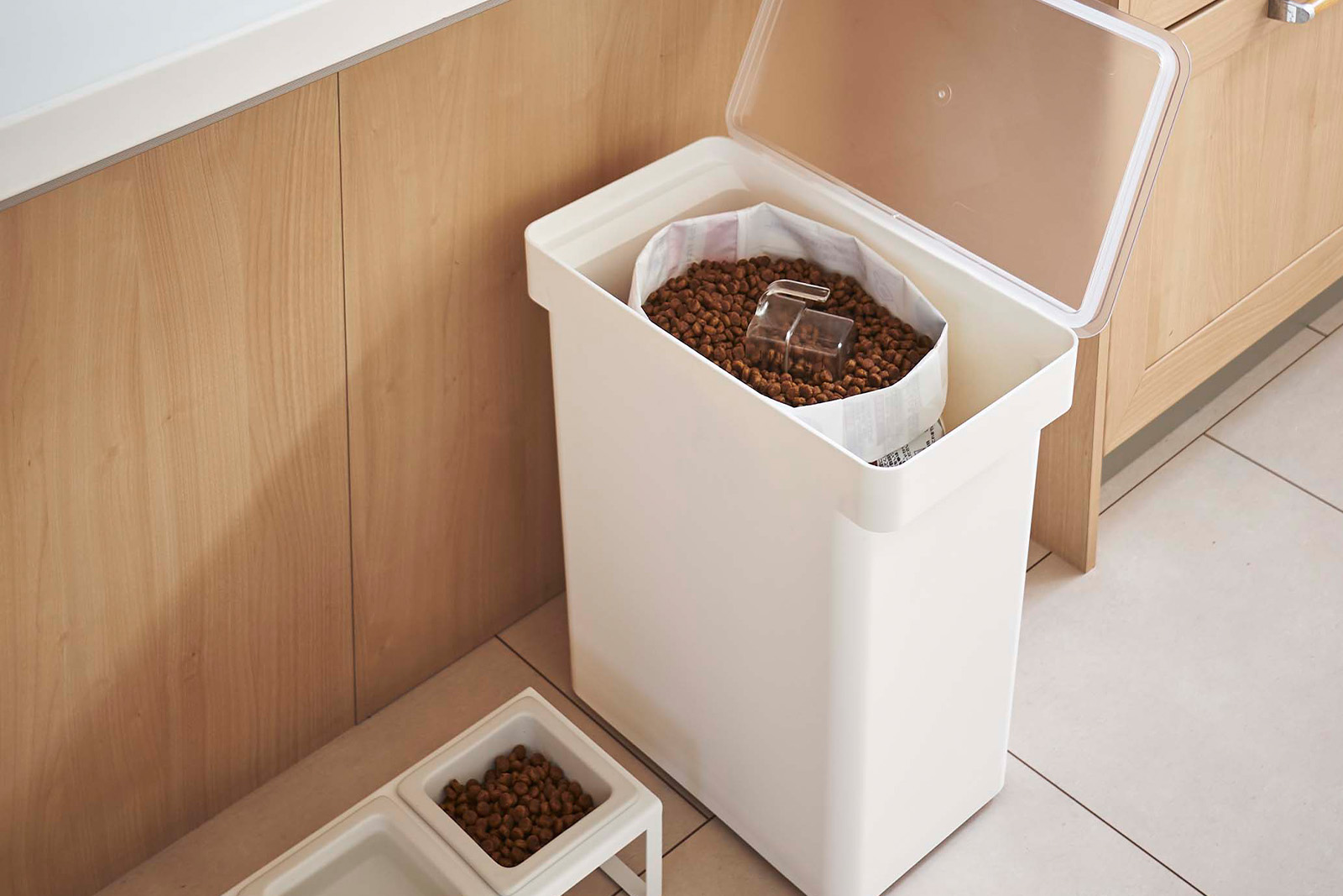 Yamazaki Home Rolling Airtight Pet Food Container holding a pet food. 