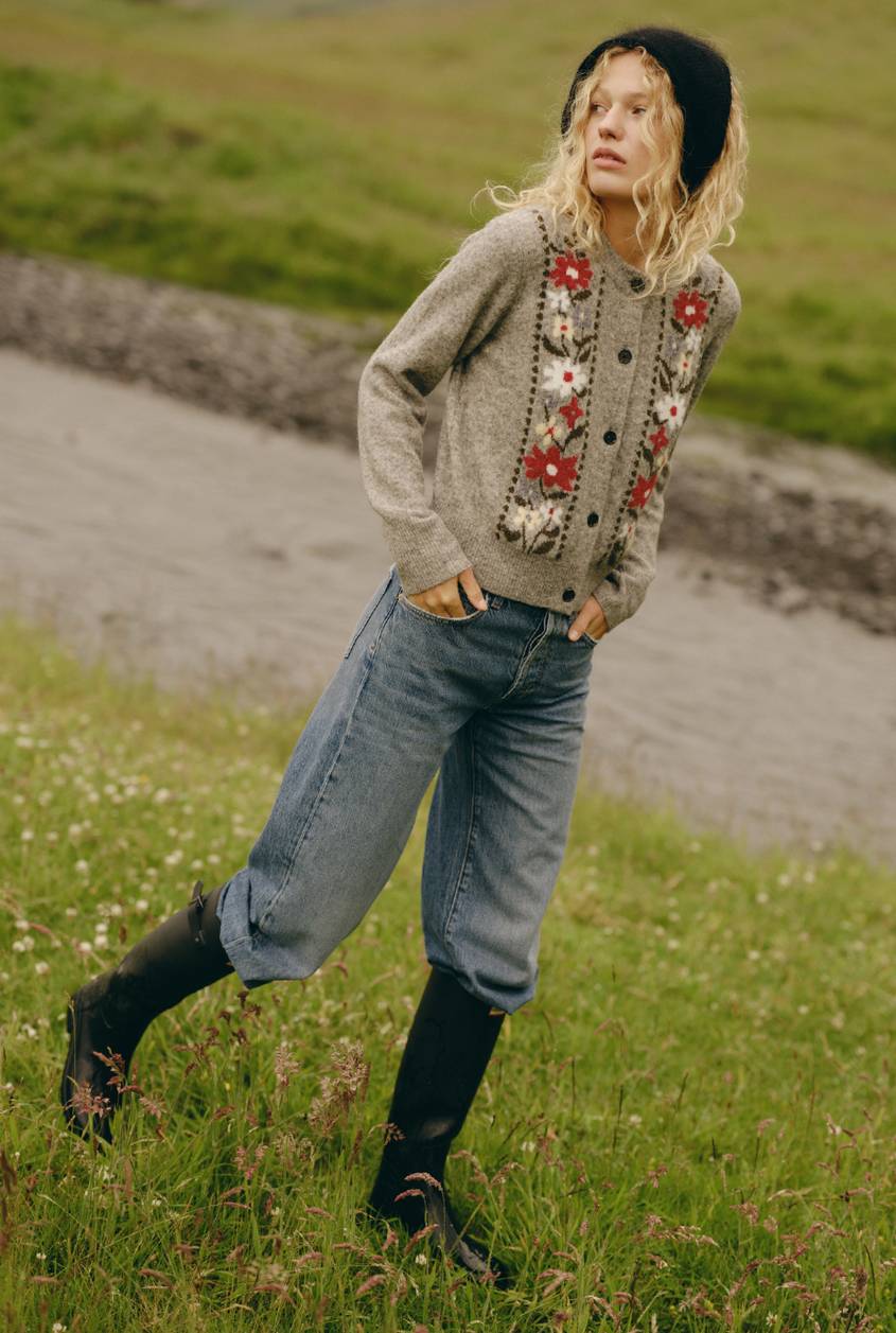 Millie Sweater in Oatmeal shown on a model to showcase the floral detailing, button-front design, and relaxed fit. Full Body View Featured on Model.