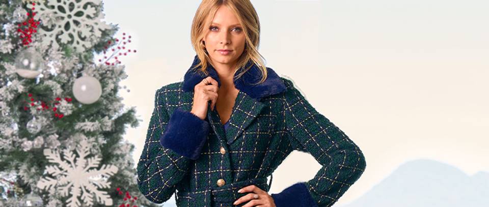 model wearing a blue and green plaid faux-fur coat.