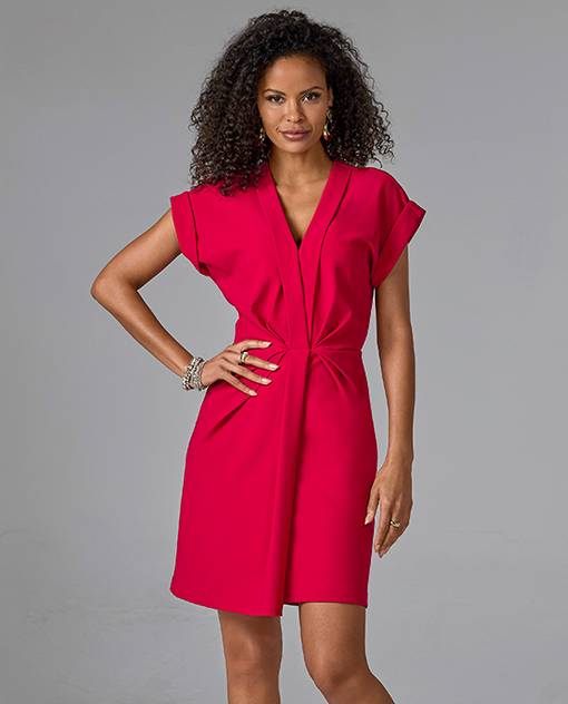 Model is wearing red v-neck short dress