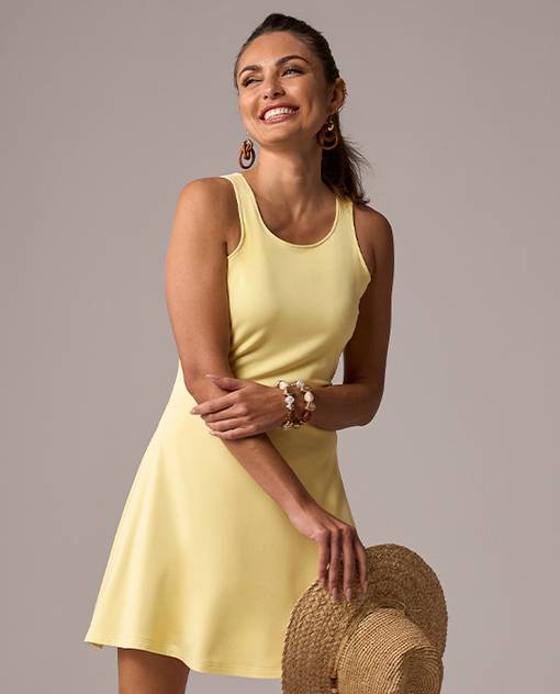 models wearing yellow sleeveless dress