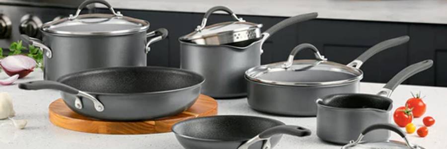 Circulon A1 ScratchDefense Extreme Non-Stick Cookware: frying pan, saute pan, stir fry wok, saucepans and lids displayed in a kitchen on a white worktop.