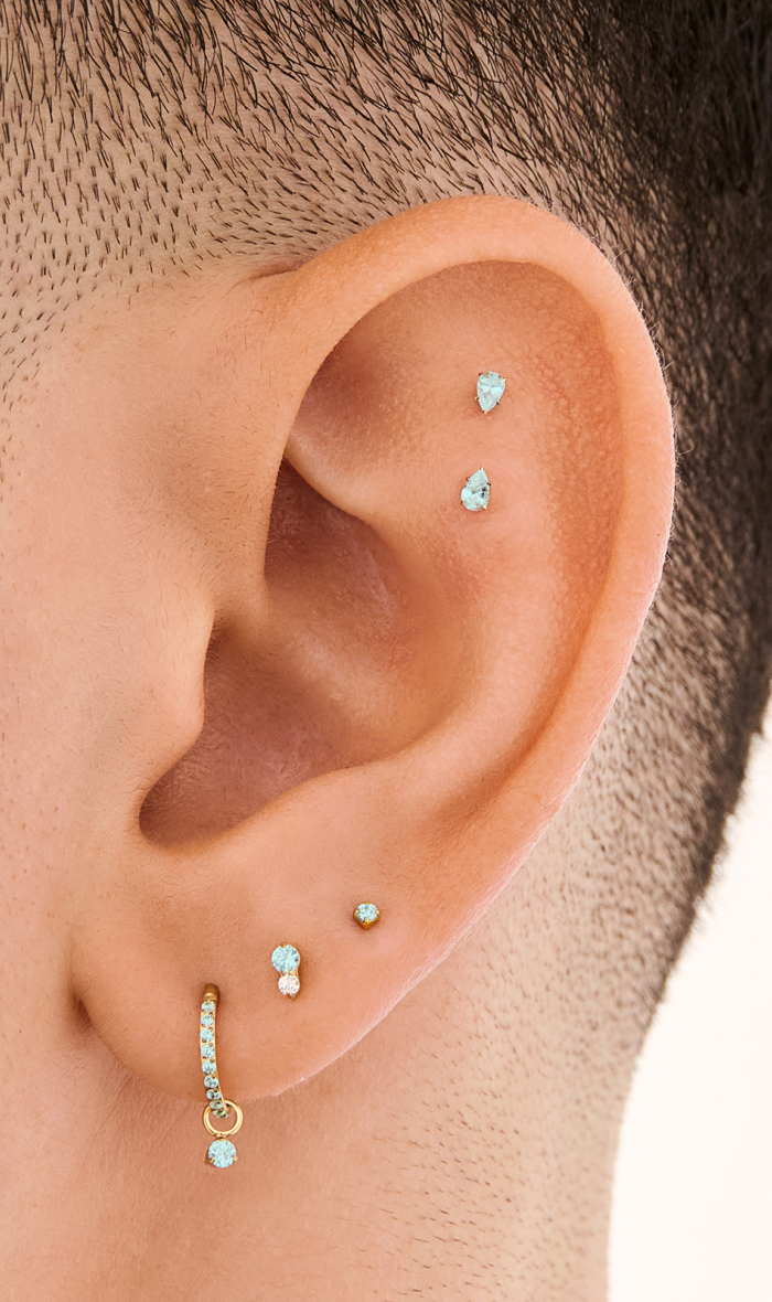Ear adorned with Studs March Birthstone earrings 