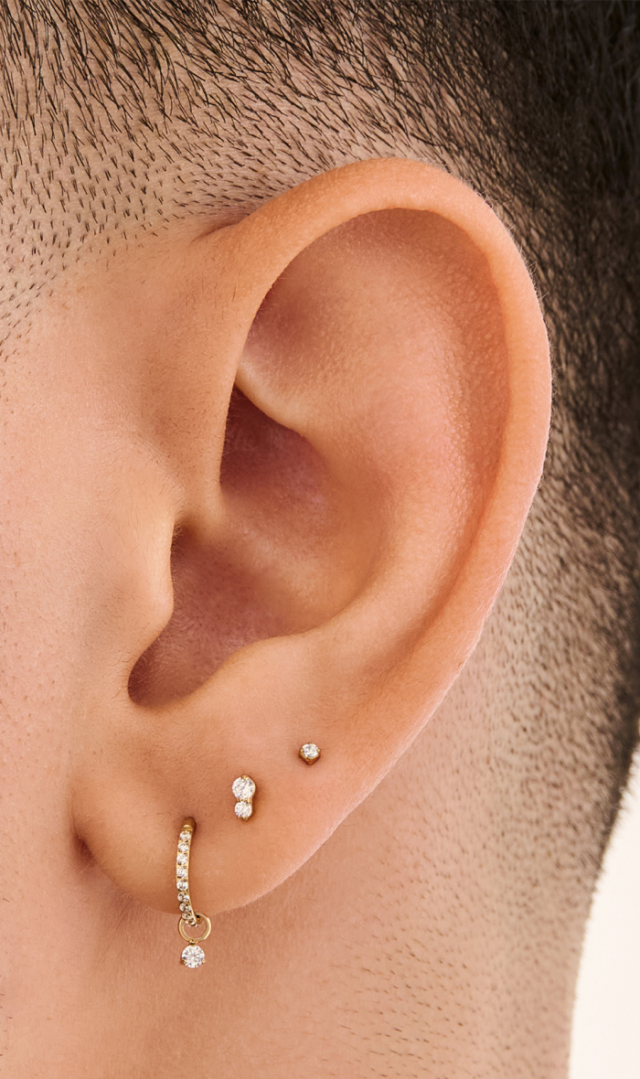 Ear adorned with Studs April Birthstone earrings 