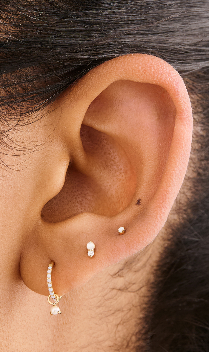 Ear adorned with Studs June Birthstone earrings 