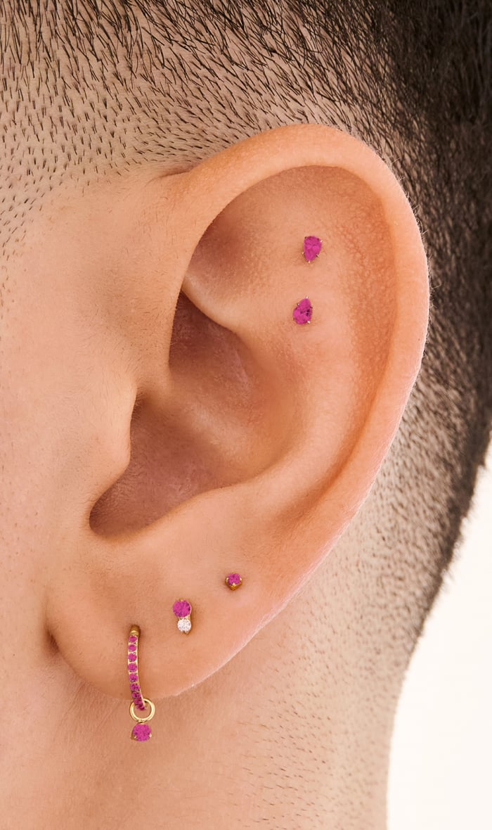 Ear adorned with Studs July Birthstone earrings 