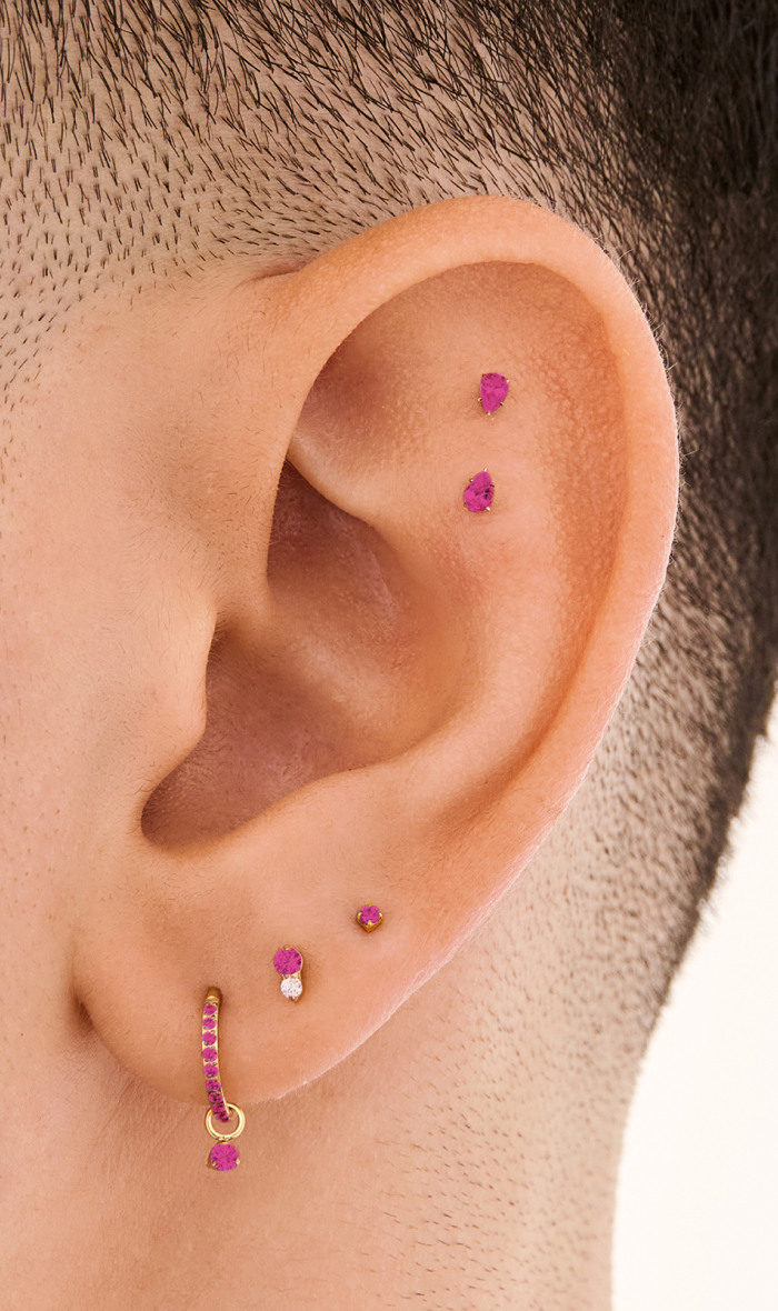 Ear adorned with Studs July Birthstone earrings 