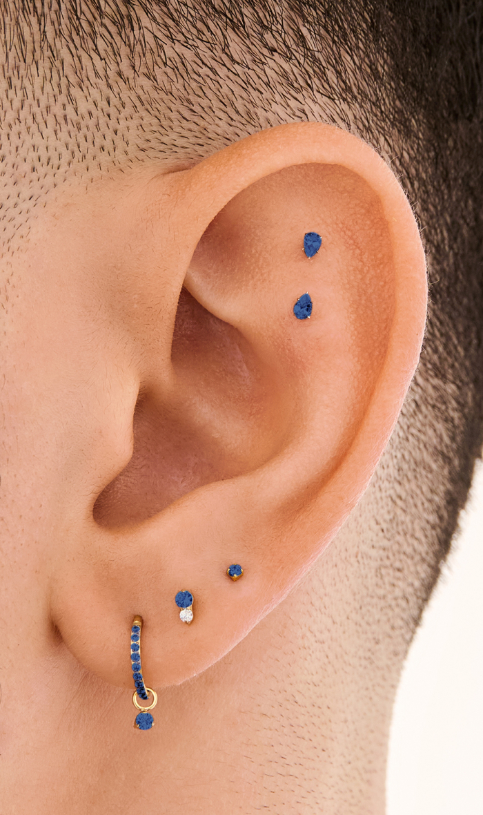 Ear adorned with Studs September Birthstone earrings 