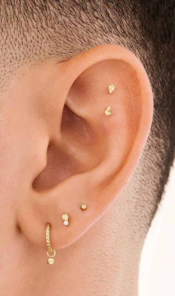Ear adorned with Studs November Birthstone earrings 