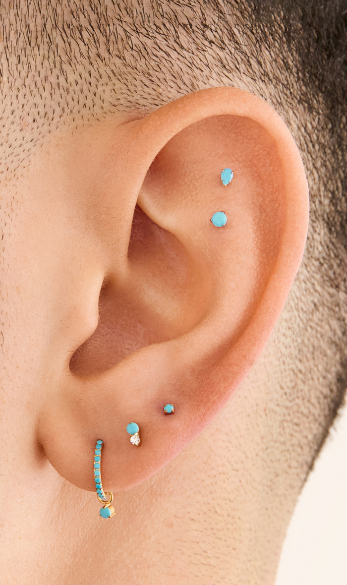 Ear adorned with Studs December Birthstone earrings 