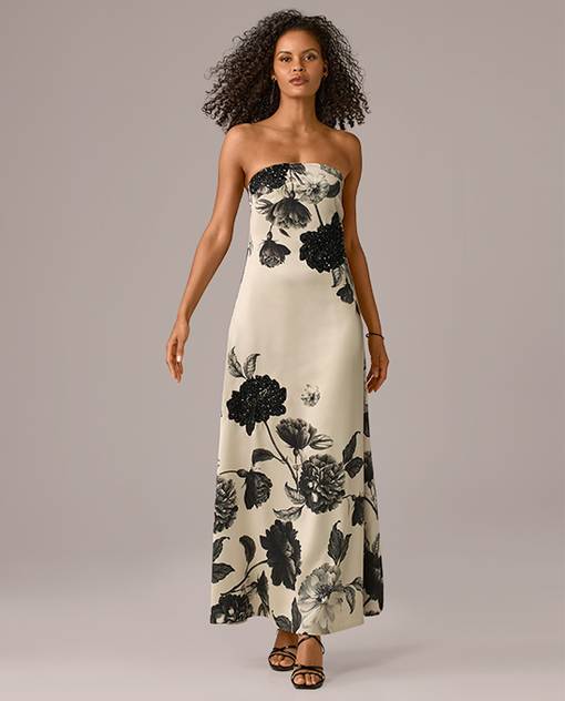 Models wearing a black floral detailed dress.