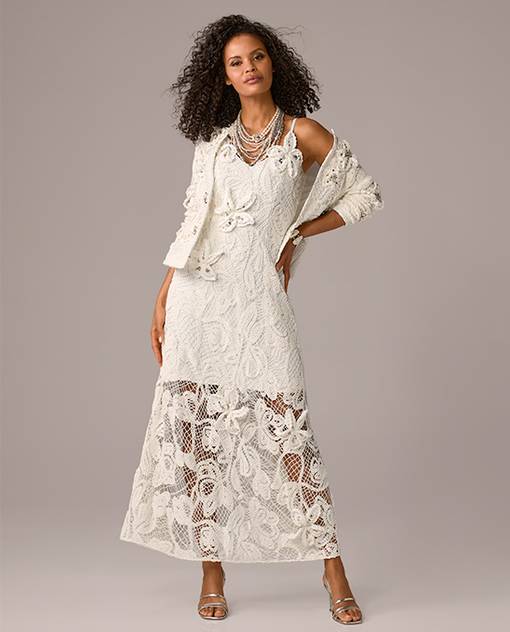 Models wearing a white and embellished dress with jacket.