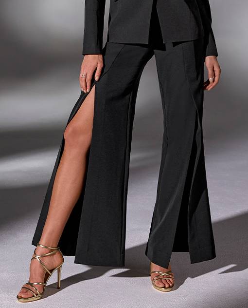 models wearing black slit front pants