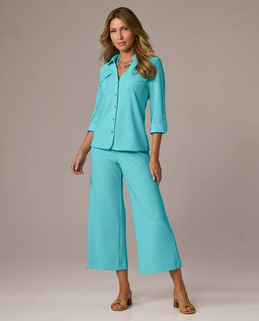 Models wearing a blue travel set