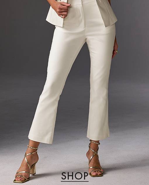 Model is wearing off white kick flare pant.