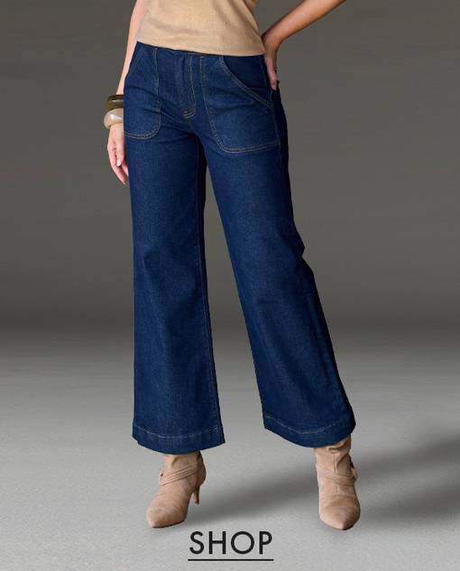 Model is wearing dark wash kick flare jeans.