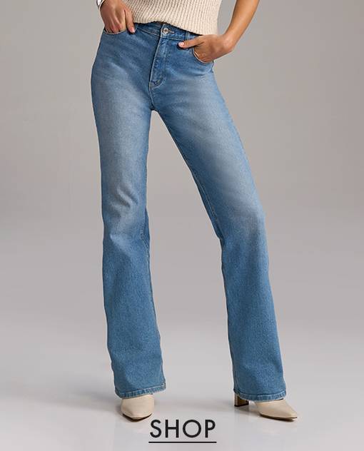 Models wearing a light wash bootcut jean