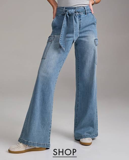 Models wearing a light wash wide leg jean.