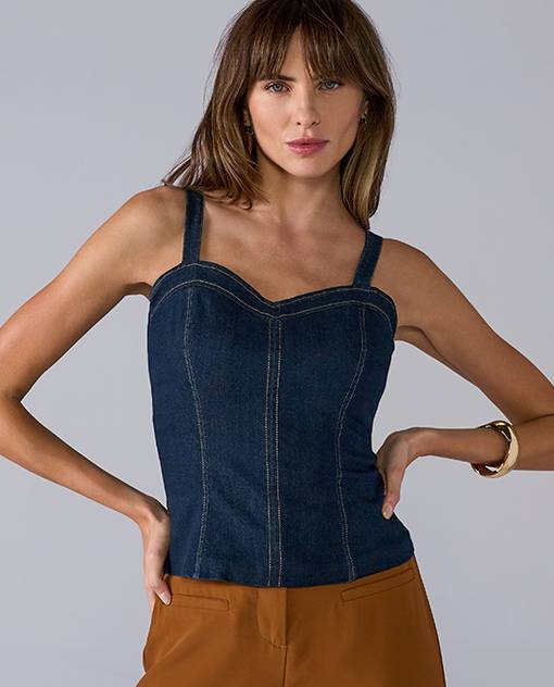 Models wearing a denim top and brown pants.