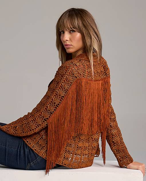 models wearing burnt orange fringe jacket