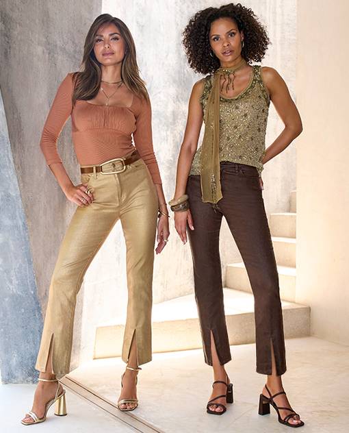 Model one is wearing metallic gold coated pants with tan top and gold heels. Model two is wearing rhinestone tank with brown ankle pant,