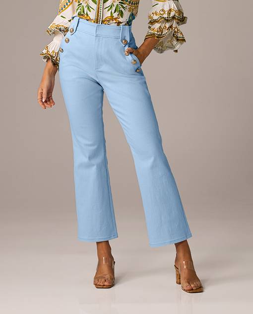 Models wearing a blue pair of kick flare jeans