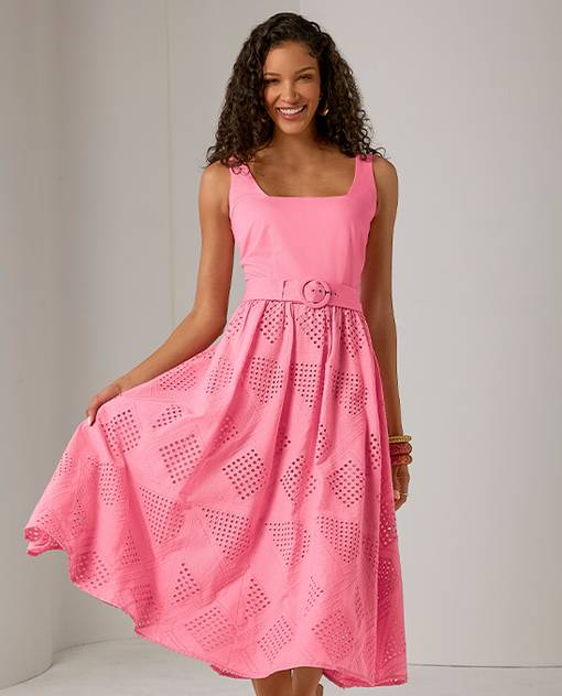Models wearing a pink dress with belted detail.